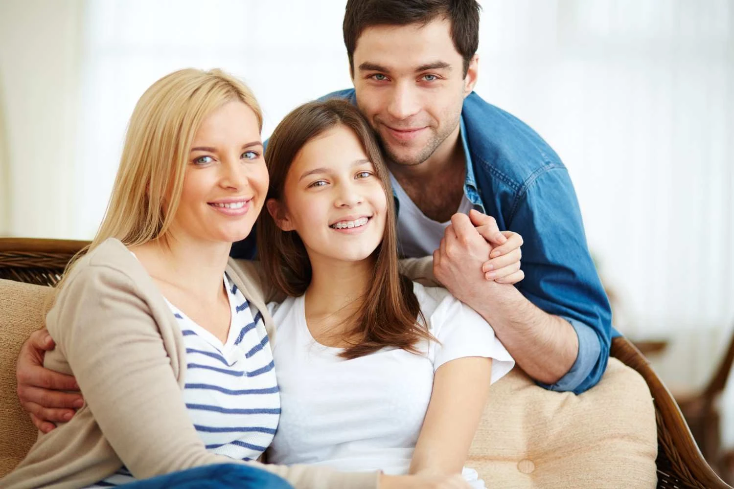 Family smiling at home